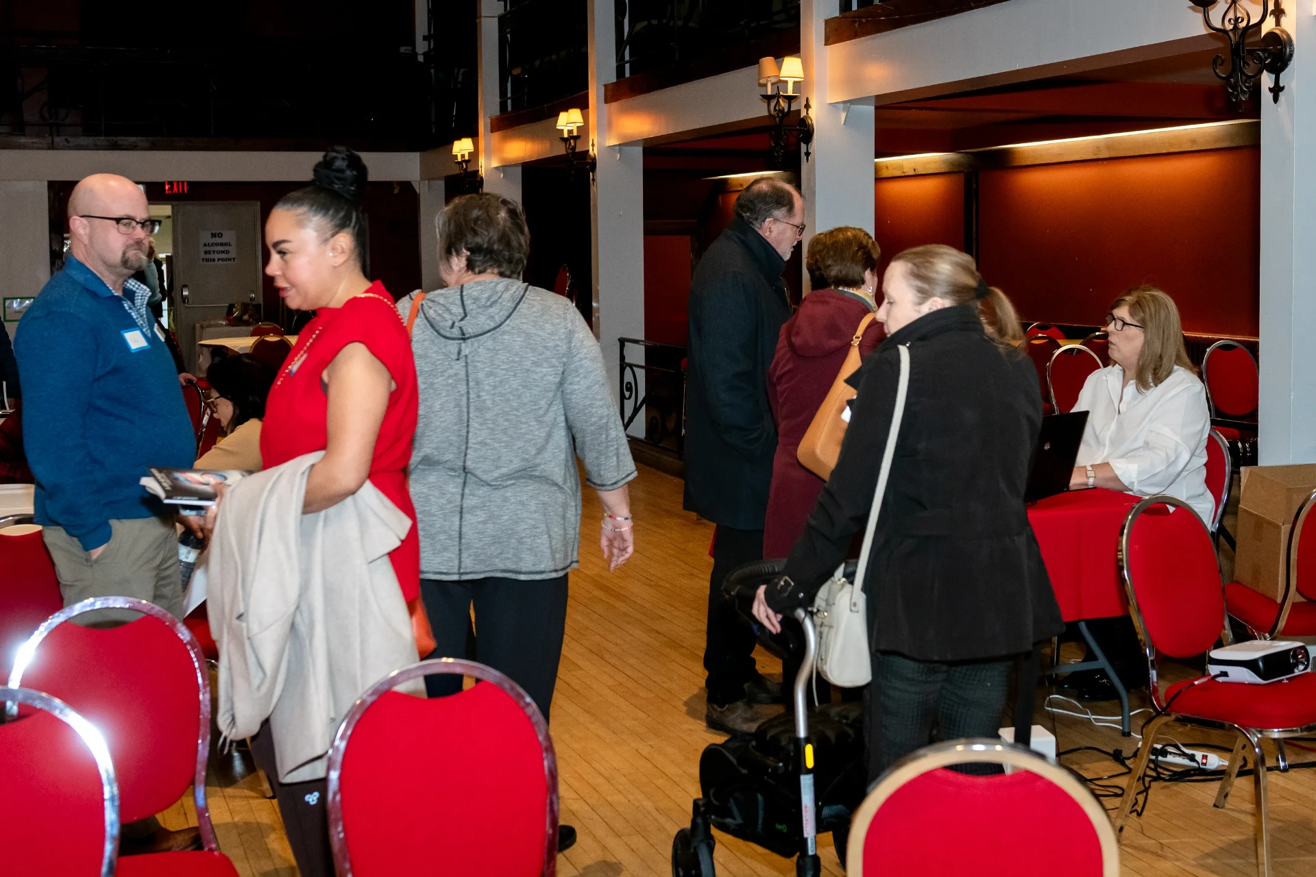 Guests mingling and meeting Janet during the event