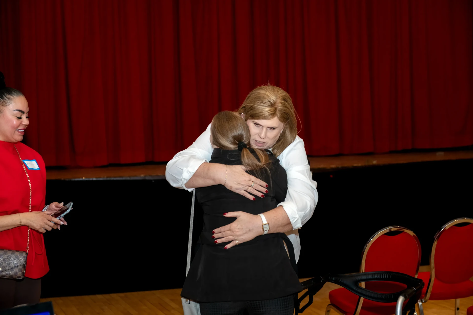 Janet sharing a warm hug with a reader