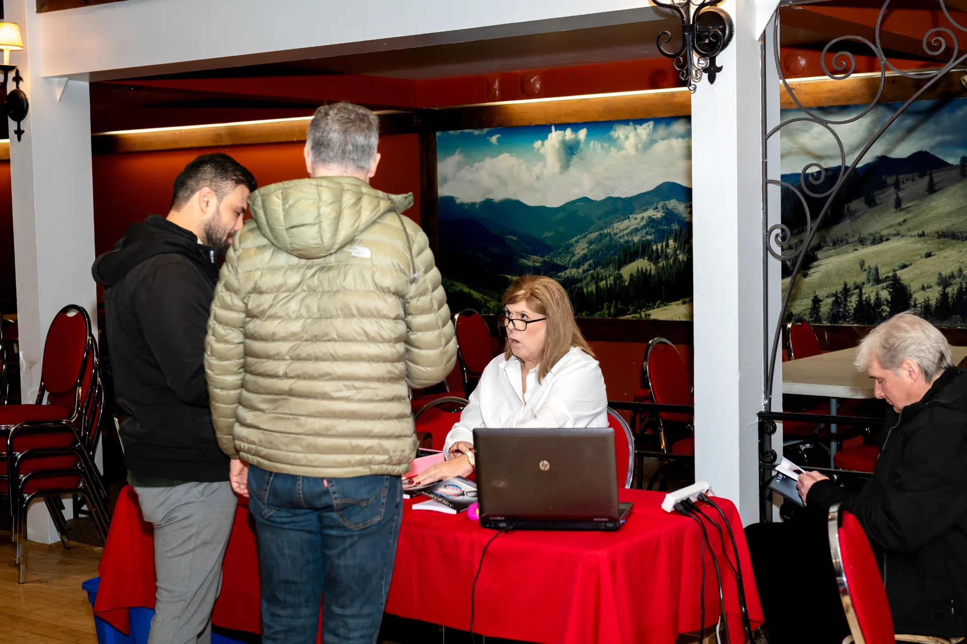 Janet greeting readers at the book signing table