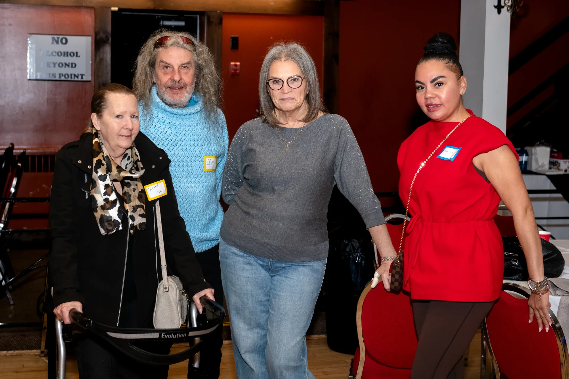 Four guests posing together at the event